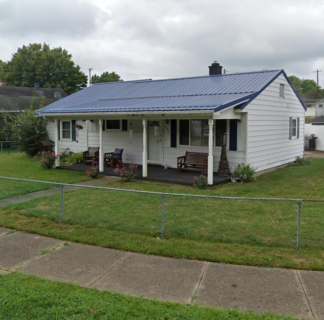 view of front of home featuring covered porch and a front yard