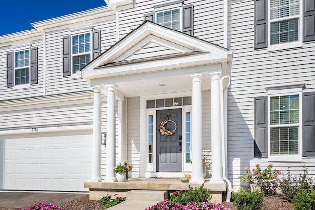 property entrance featuring a garage