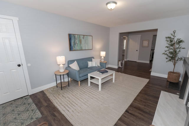 living room featuring dark hardwood / wood-style flooring