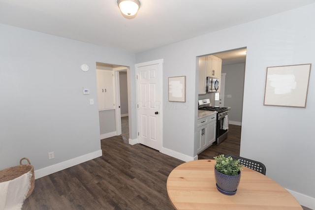 dining area featuring dark hardwood / wood-style flooring