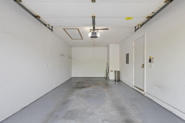 garage featuring a garage door opener and electric panel
