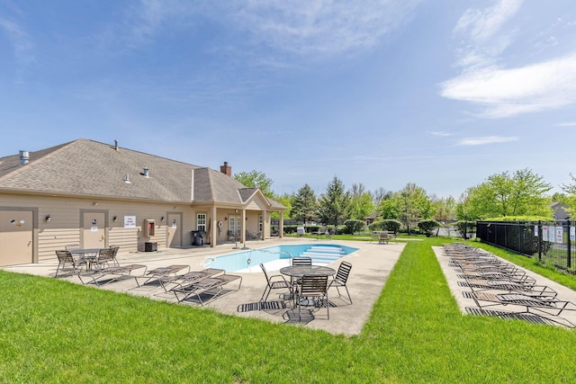 community pool featuring a yard, a patio, and fence