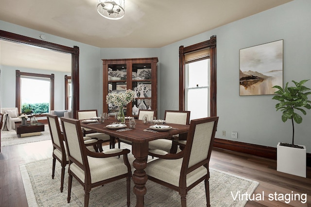 dining space featuring hardwood / wood-style flooring and a wealth of natural light