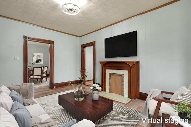 living room with hardwood / wood-style flooring and ornamental molding