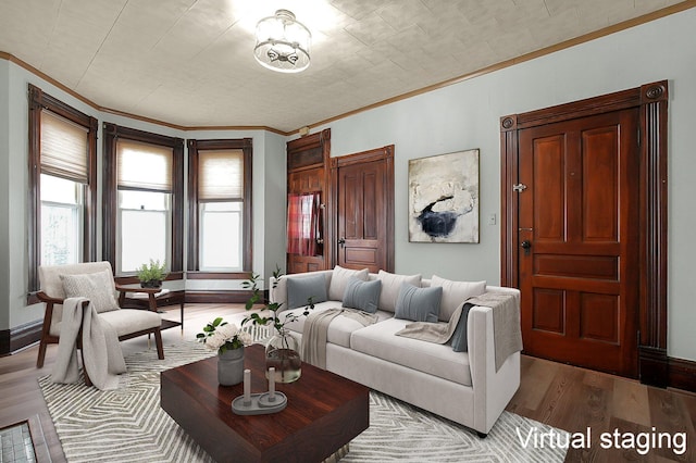 living room with crown molding and light wood-type flooring