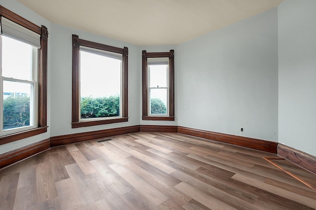 unfurnished room featuring light wood-type flooring