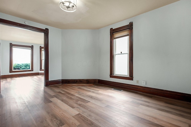 unfurnished room featuring wood-type flooring