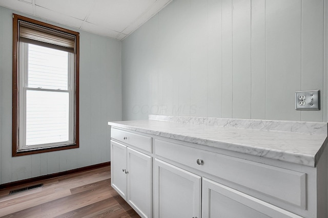 interior space featuring vanity and hardwood / wood-style floors