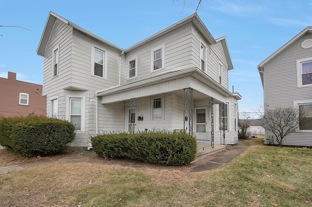 view of front of house with a front lawn and covered porch