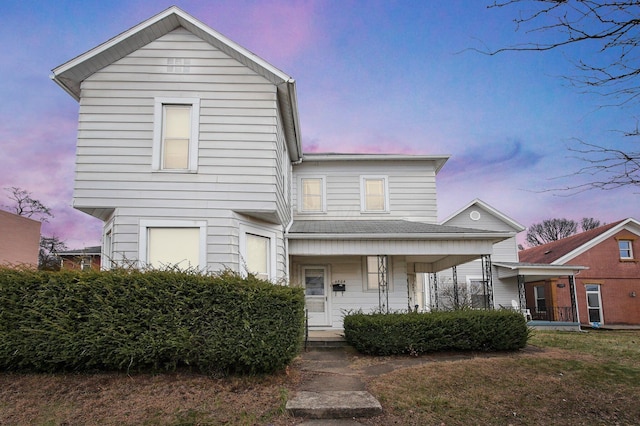 view of property featuring a porch