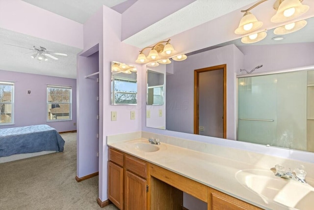 full bath featuring double vanity, ensuite bath, ceiling fan, and a sink