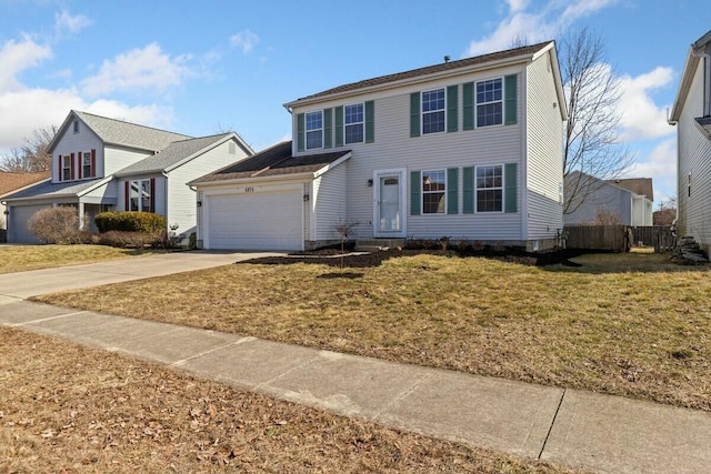 colonial inspired home with a garage, a front yard, driveway, and fence