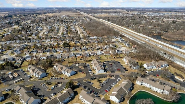 birds eye view of property featuring a water view and a residential view