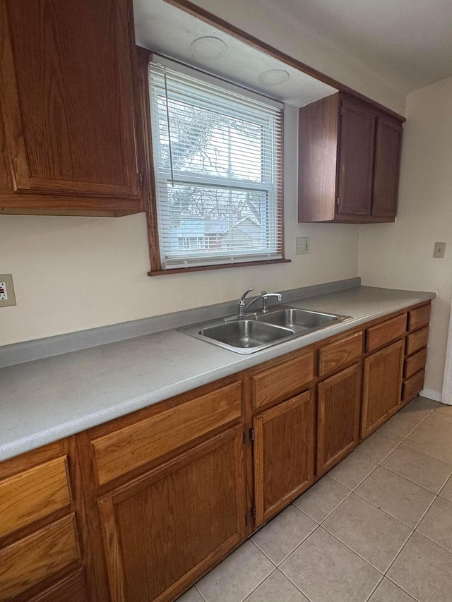 kitchen with sink and light tile patterned floors