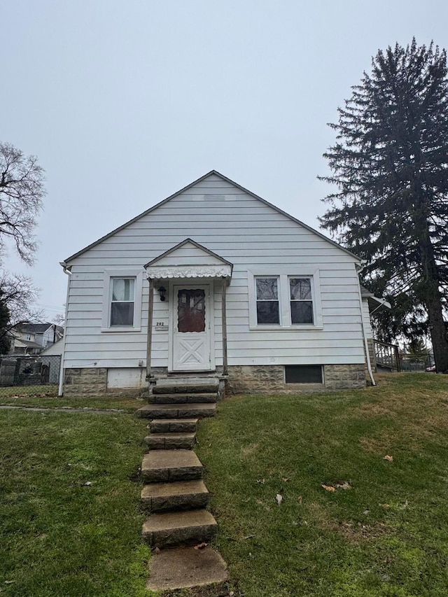 view of front of property with a front lawn