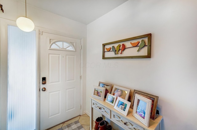 foyer with light tile patterned flooring