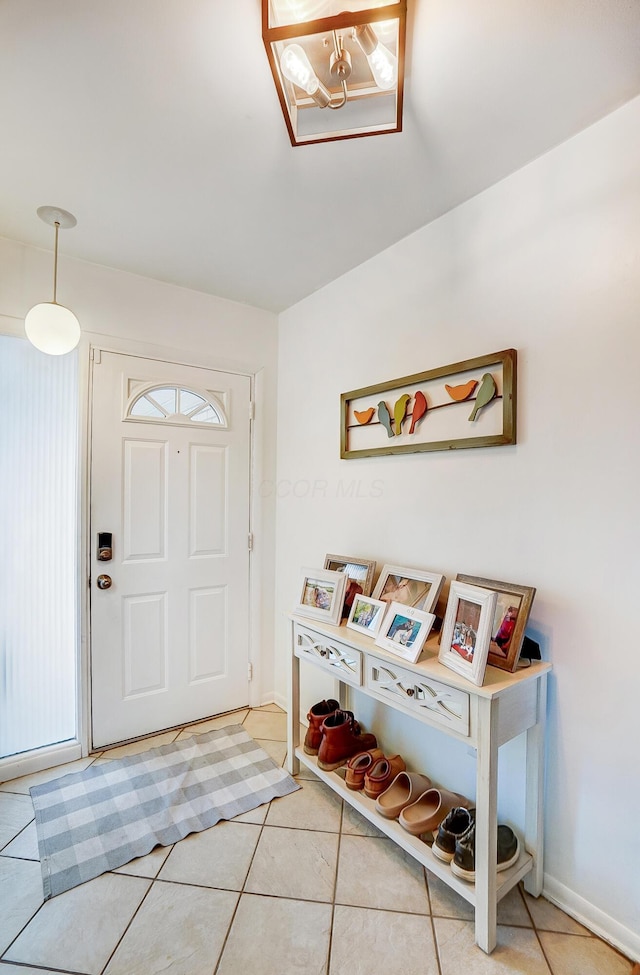 foyer entrance featuring tile patterned flooring