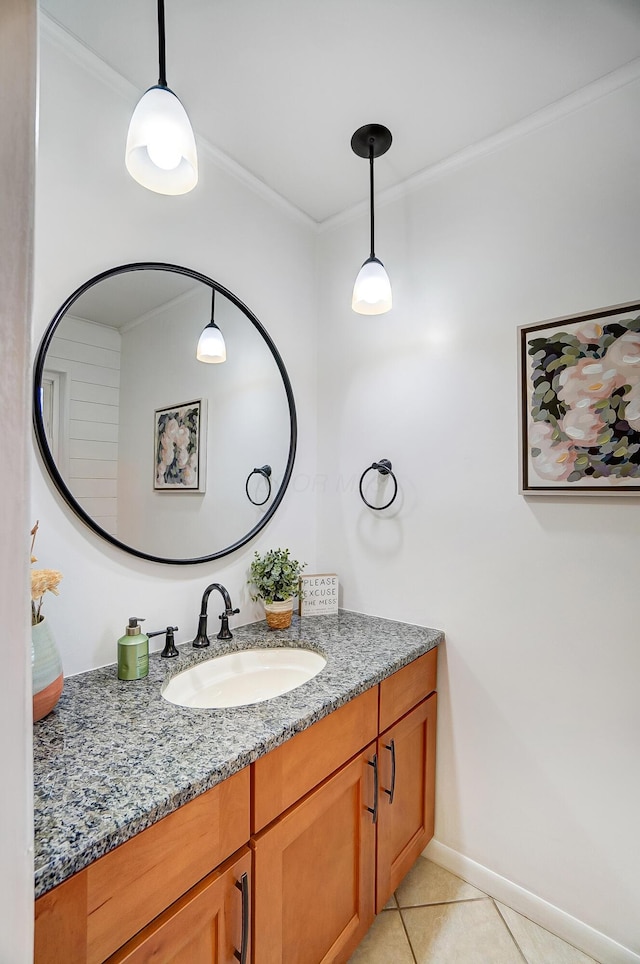 bathroom with crown molding, vanity, and tile patterned flooring