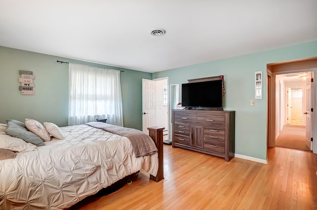 bedroom with light hardwood / wood-style floors