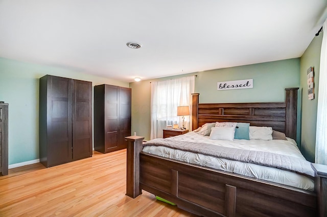 bedroom featuring light hardwood / wood-style floors