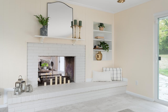 details with ornamental molding, carpet, a fireplace, and built in shelves