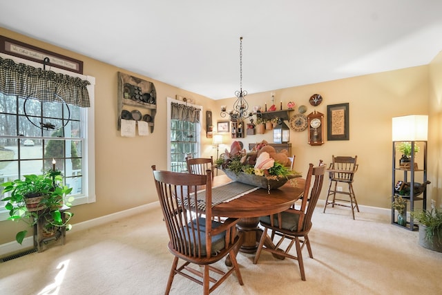 view of carpeted dining space