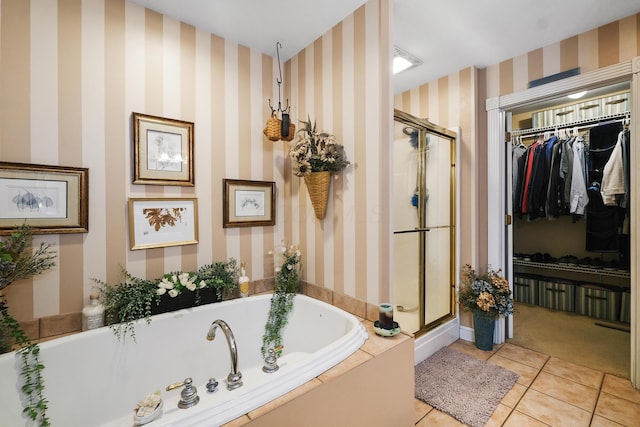 bathroom with tile patterned floors and separate shower and tub