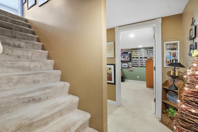 stairs with carpet flooring