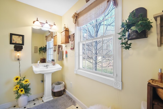bathroom with sink and a healthy amount of sunlight