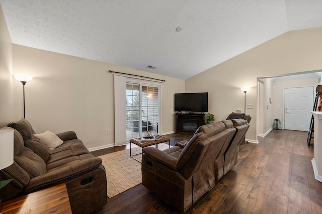 living area with baseboards, dark wood-type flooring, a fireplace, and vaulted ceiling