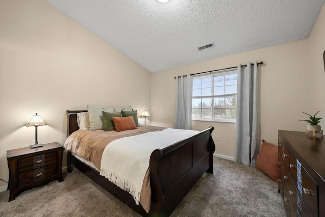 bedroom with visible vents, lofted ceiling, a textured ceiling, carpet floors, and baseboards