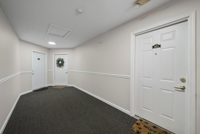 doorway to outside featuring carpet and baseboards