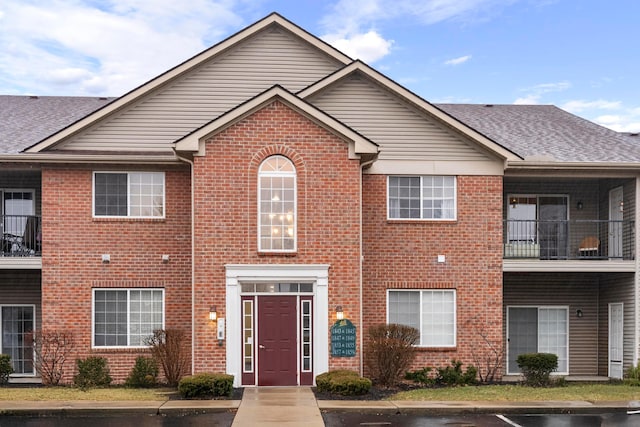 view of property with brick siding