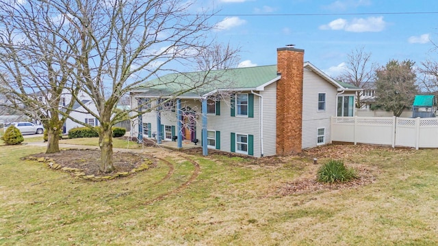 view of home's exterior featuring a lawn
