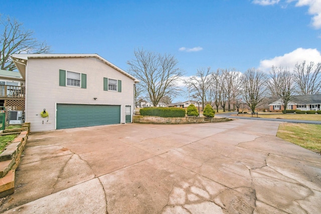 view of side of home featuring a garage