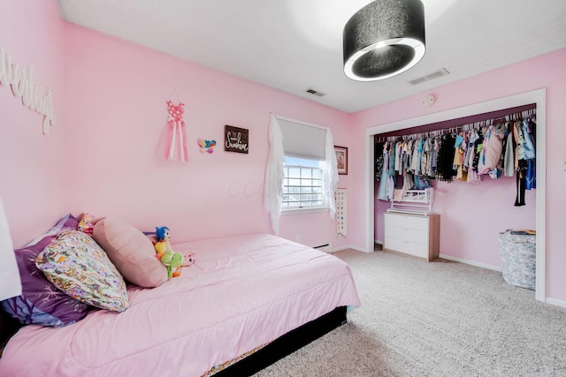 carpeted bedroom featuring a closet