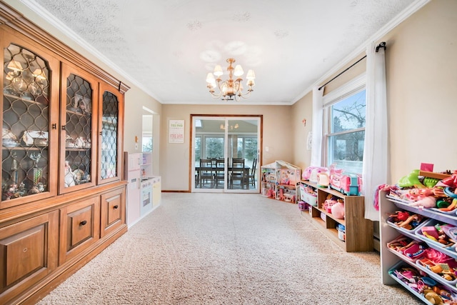 playroom with crown molding, a textured ceiling, and a chandelier