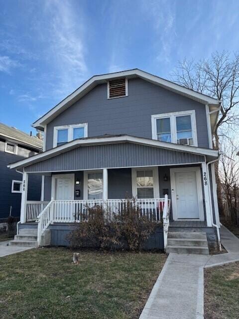 view of front of house featuring a front lawn and a porch