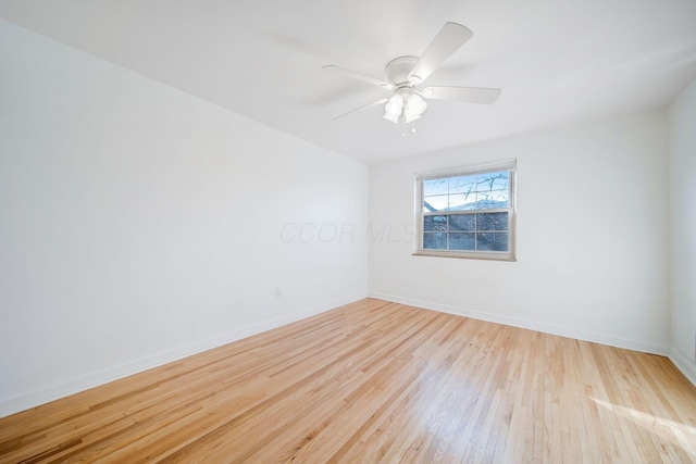 empty room featuring ceiling fan and light wood-type flooring