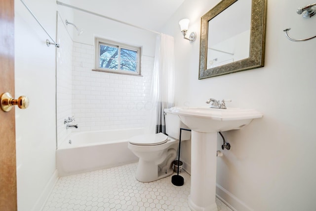 bathroom with toilet and shower / bath combo