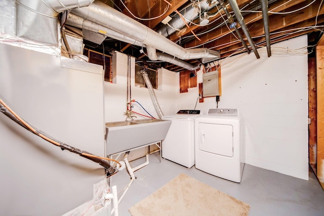 laundry room featuring sink and washer and dryer