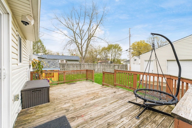 deck with a yard and a fenced backyard