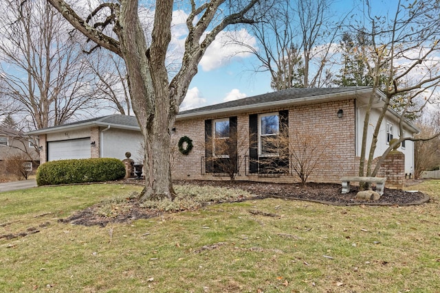 single story home with a garage and a front lawn