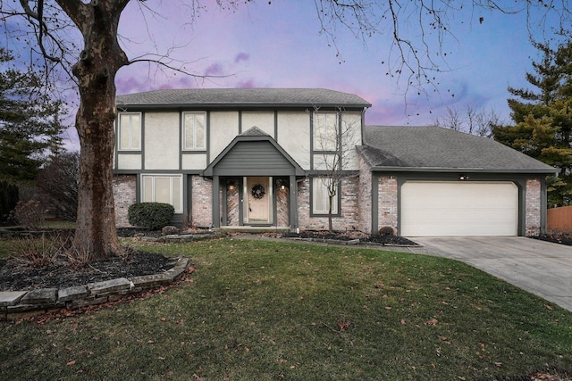 tudor house with a garage and a yard