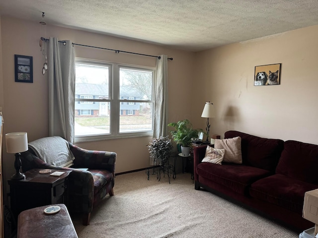 living room with a textured ceiling and carpet