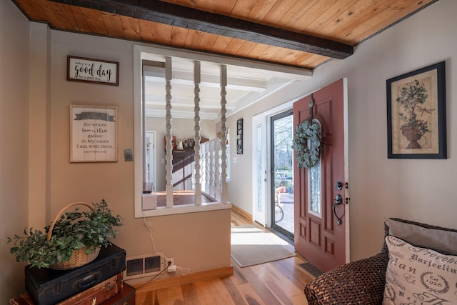 entrance foyer with beam ceiling, wood ceiling, and light hardwood / wood-style floors