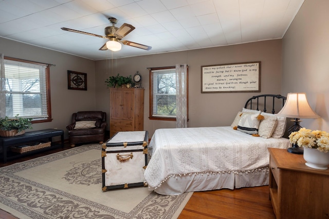 bedroom with ceiling fan and wood-type flooring