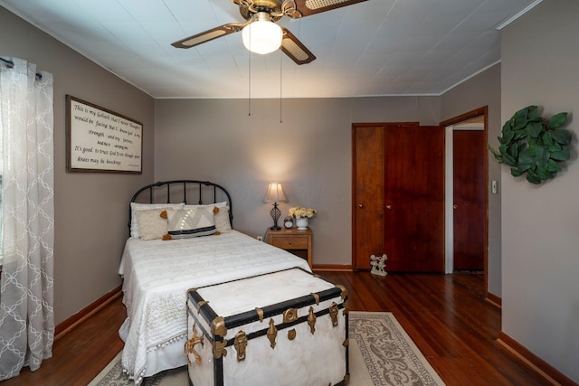 bedroom featuring dark hardwood / wood-style floors and ceiling fan