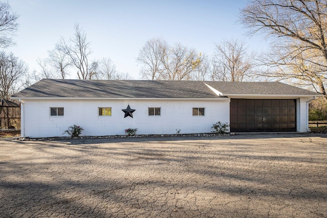 view of side of property featuring a garage