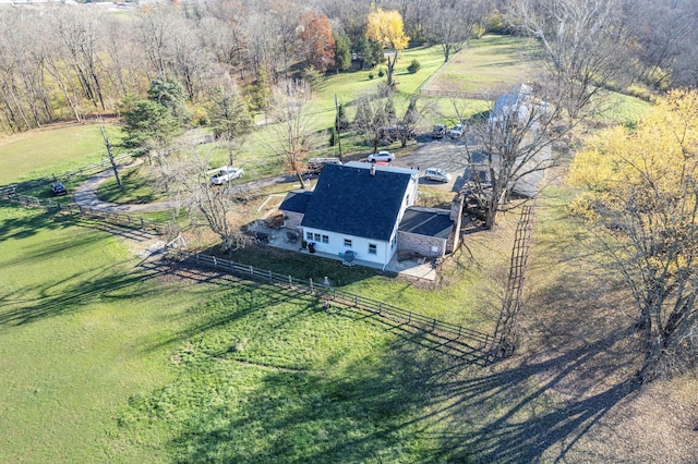 birds eye view of property with a rural view